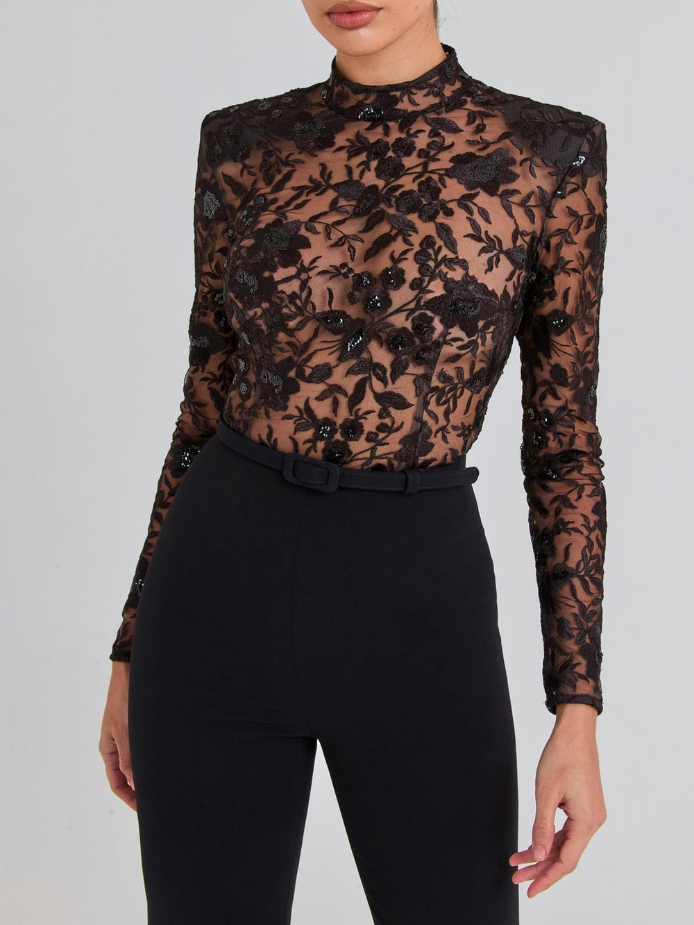 Schwarzer durchsichtiger langärmeliger Hosen-Jumpsuit